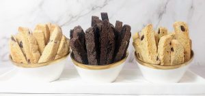 Assorted biscotti in bowls: chocolate chip, dark chocolate, and cranberry orange for weddings and events in Central Florida.