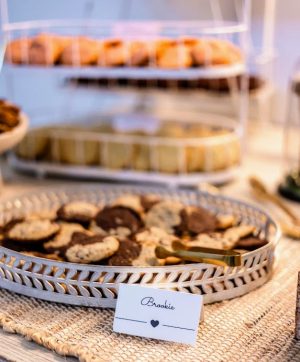 Brookie cookies served in white basket tray on rustic table for Ever After Farms wedding.