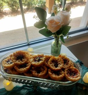 Cherry baby pies with crumb topping styled with blush roses for weddings, showers, and events in Central Florida, Orlando, St. Augustine, and Daytona.