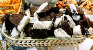 Chocolate brownie bites dipped in cookies and cream coating for weddings, parties, corporate events, and dessert tables across Central Florida, Orlando, St. Augustine, and Daytona.