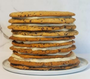 Layered chocolate chip cookie cake with buttercream, ideal for weddings, birthdays, and events in Central Florida.