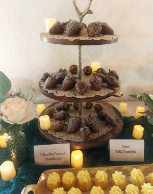Elegant display of chocolate-covered strawberries on a tiered wooden stand, styled for weddings, Valentine's Day, or corporate events in Central Florida, including Orlando, Daytona, and St. Augustine.