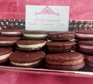 Chocolate sandwich cookies filled with vanilla, strawberry, and fudge at a glamorous Orlando celebration display.