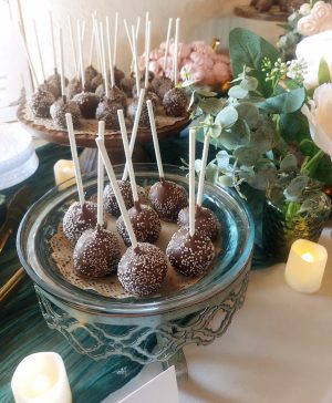 Chocolate cake pops with white sprinkles in glass bowl for rustic country weddings at Sterling in Orlando.