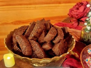 Dark chocolate biscotti cookies in gold bowl at Orlando wedding dessert table, Club Lake Venue Apopka.