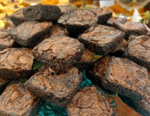 Chocolate brownie bites with crackled tops stacked for weddings, parties, and corporate events across Central Florida, Orlando, St. Augustine, and Daytona dessert tables.