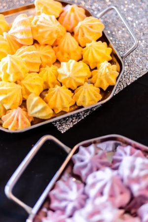 Lemon, peach, and plum meringues in modern silver trays for weddings, parties, and showers in Central Florida, Orlando, St. Augustine, and Daytona with whimsical and glam dessert themes.