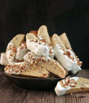 White chocolate dipped maple walnut biscotti perfect for weddings, showers, and dessert tables in Orlando.