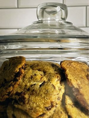 Thick, chewy old-fashioned chocolate chip cookies stacked inside a vintage-style glass jar. A timeless treat from The Cookie Jar Orlando, perfect for weddings, cookie tables, corporate events, and nostalgic dessert displays.