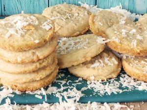 Tropical piña colada cookies with shredded coconut topping, perfect for beach weddings, luau themes, or summer celebrations.