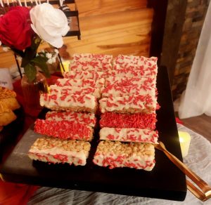 Rice Krispy treats dipped in white chocolate with red sprinkles for weddings, corporate events, and parties in Central Florida, Orlando, St. Augustine, and Daytona.