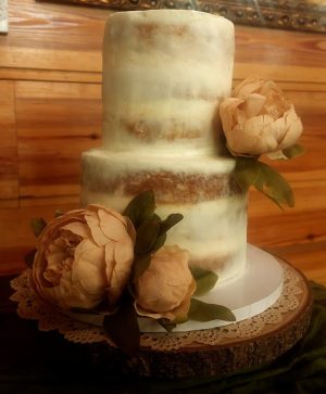 Rustic semi-naked wedding cake with blush peonies at Club Lake Venue in Orlando for country weddings.