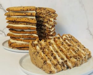 Sliced chocolate chip cookie cake with layers of buttercream, perfect for weddings, birthdays, and events in Central Florida.
