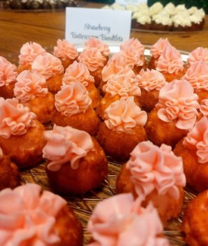 Mini strawberry bundt cakes with pink frosting on tray for Orlando weddings, showers, birthdays, and corporate events.