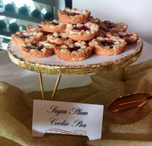Sugar plum cookie pies on a gold stand for Christmas and holiday parties in Central Florida, Orlando, Daytona, and St. Augustine for corporate events, weddings, and festive dessert tables.