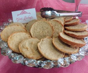 Tres leches cookies arranged on a sparkling crystal tray at a Central Florida quinceañera celebration.