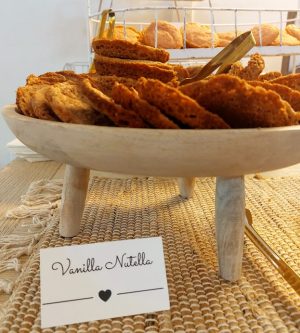 Vanilla Nutella cookies stacked on rustic wooden tray for Ever After Farms wedding dessert table.