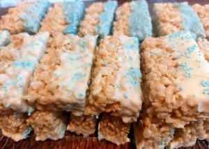 White chocolate dipped Rice Krispy treats with blue sprinkles for St. Augustine wedding and shower dessert tables.